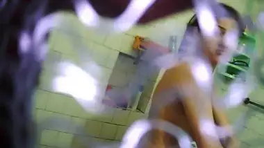 Hidden camera films hot Indian teen getting naked in the bathroom