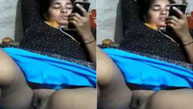 Whore is talking on the phone while lover is touching her Desi vag