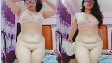 Curly Indian girl with glasses brags about juicy butt in the porn show