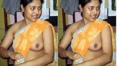 Indian girl with small boobies pulls tank top up exposing her pride