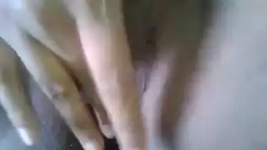 horny girl fingering her sahved pussy
